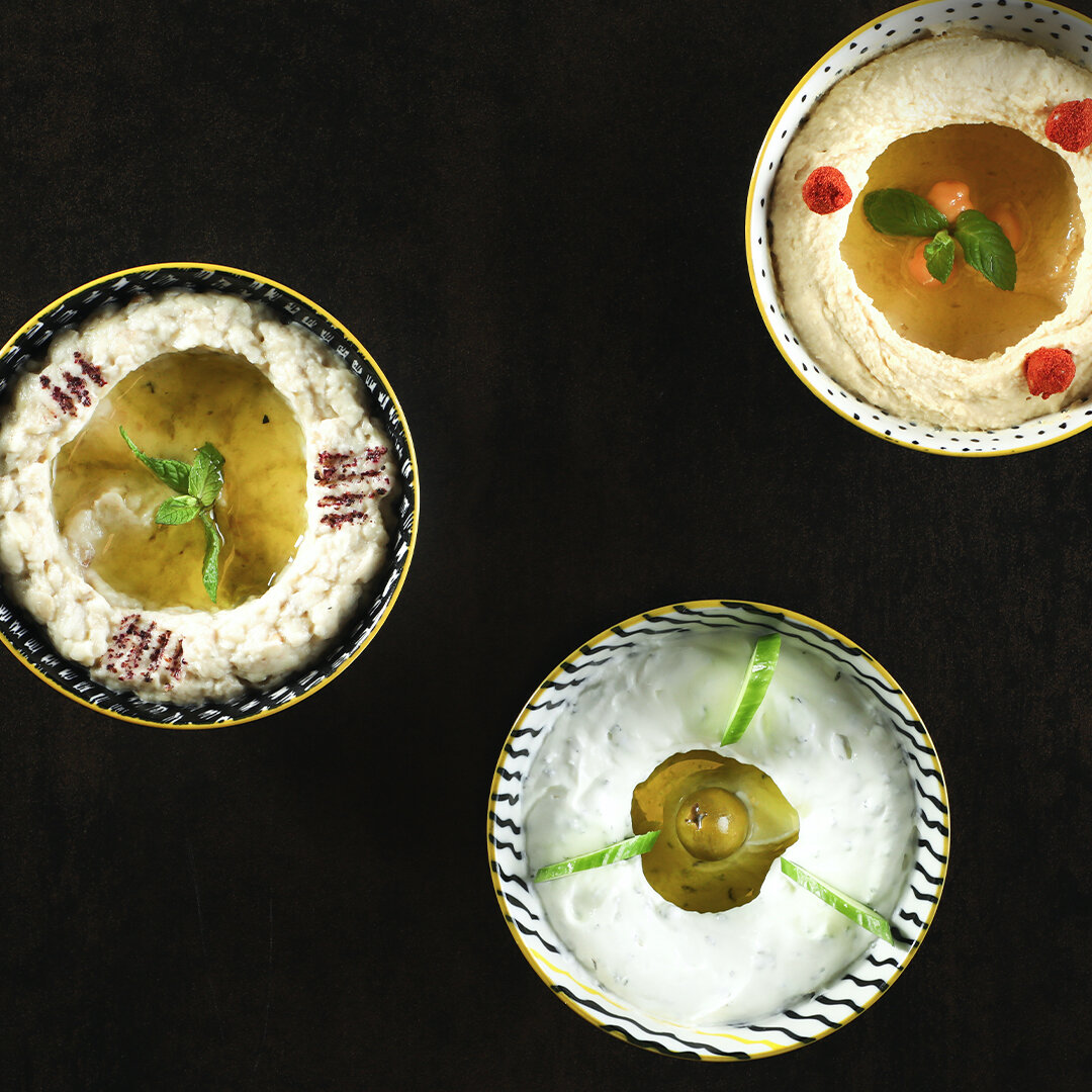 Hummus, Moutabbal and Labne bi toum.jpg